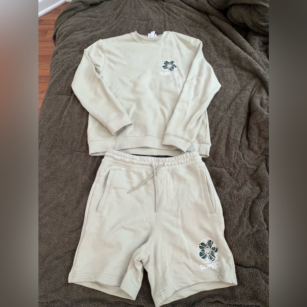 Set! Crewneck sweatshirt with sweat shorts. It is a light/mint green color.